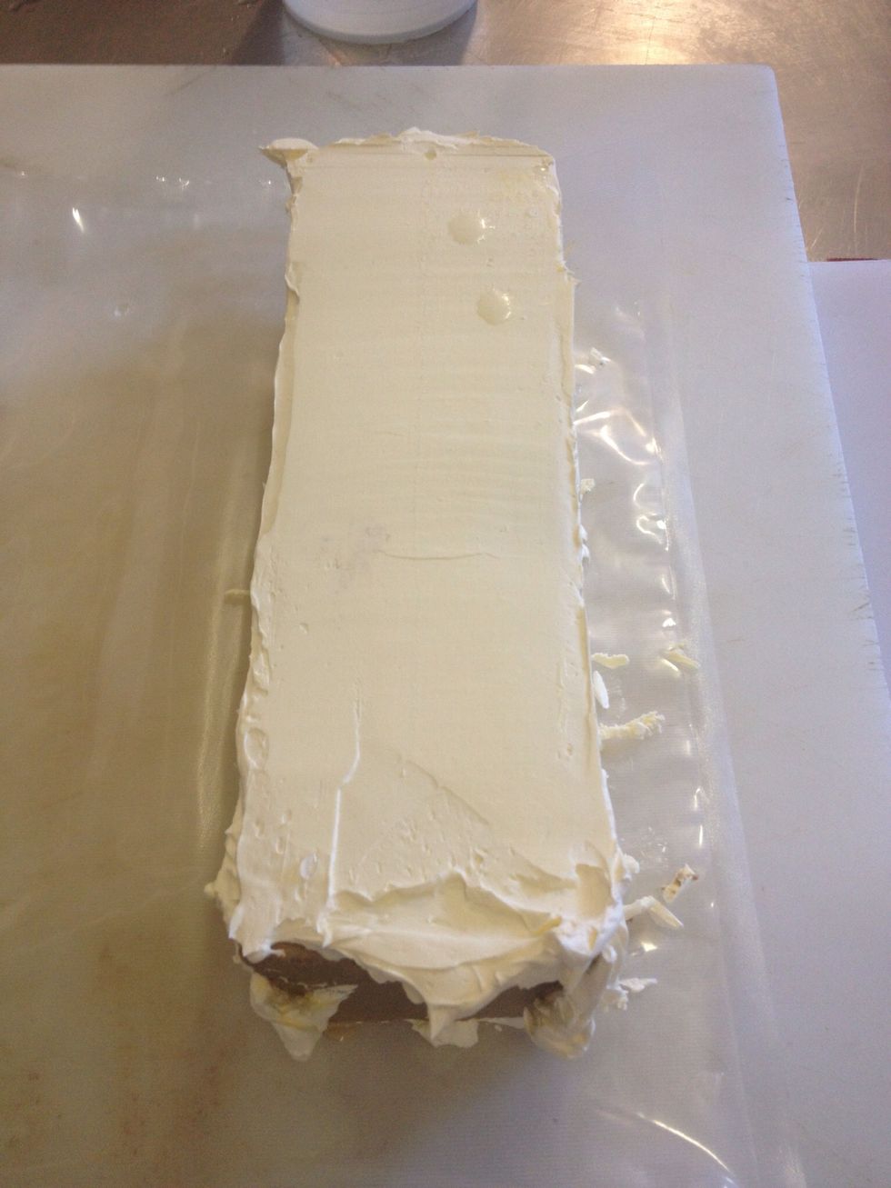 Get a hot knife and start gently scraping back the butter