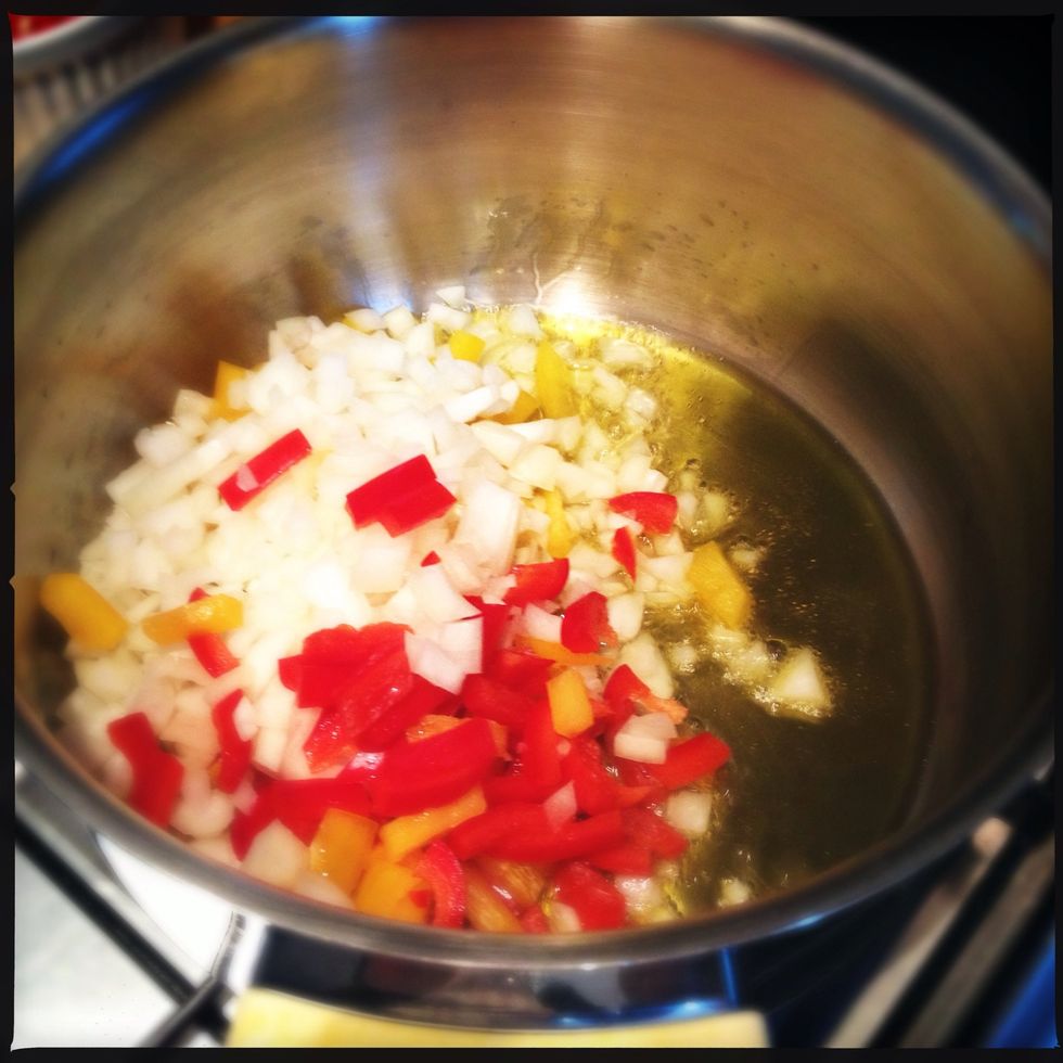 Get a large pan and put in some olive oil and cook the onions and paprika untill the onions are glassy.