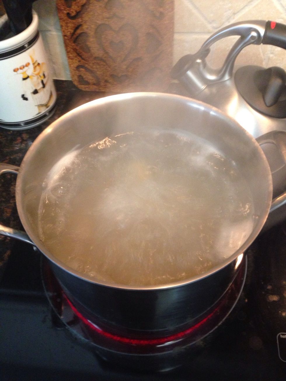 Get a large pot of salted water boiling on the stove top for cooking the Farfalle pasta.
