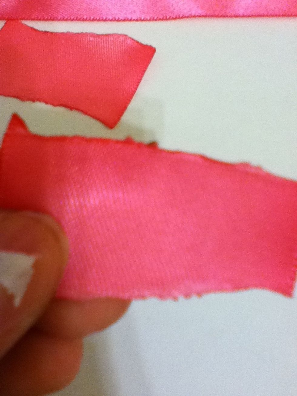 Get a lighter and dab the sides to prevent and get rid of strings