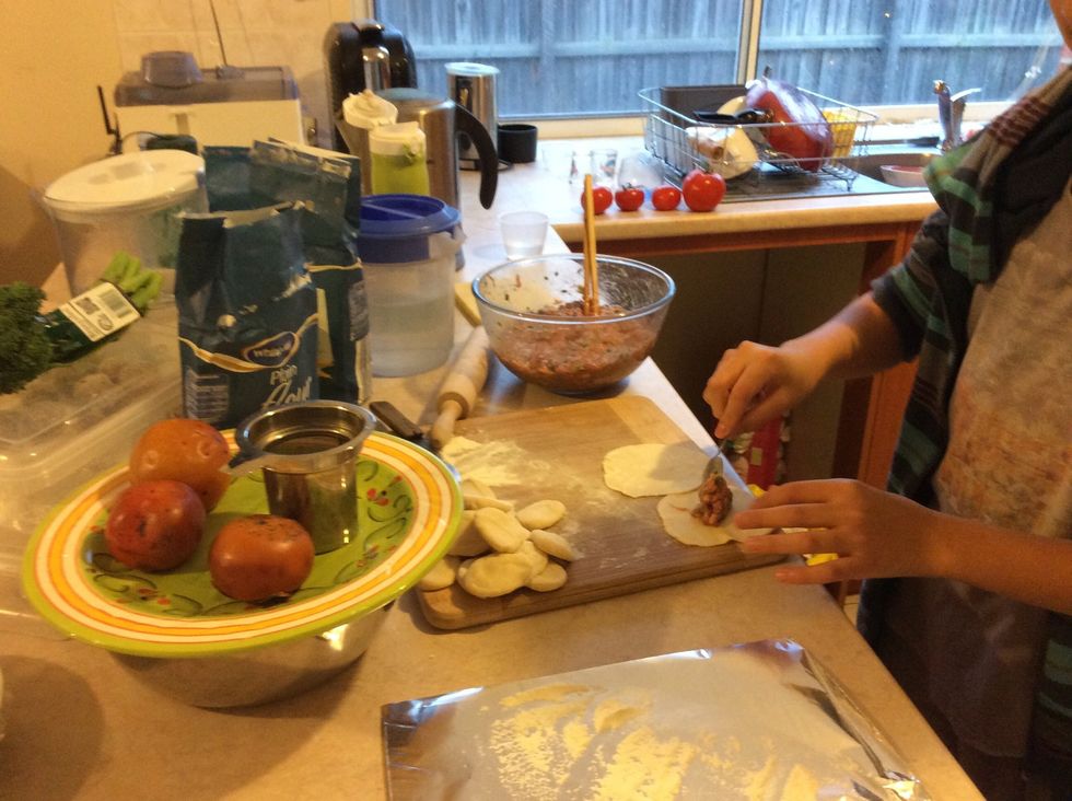 Get a little bit of meat and put it in the flour