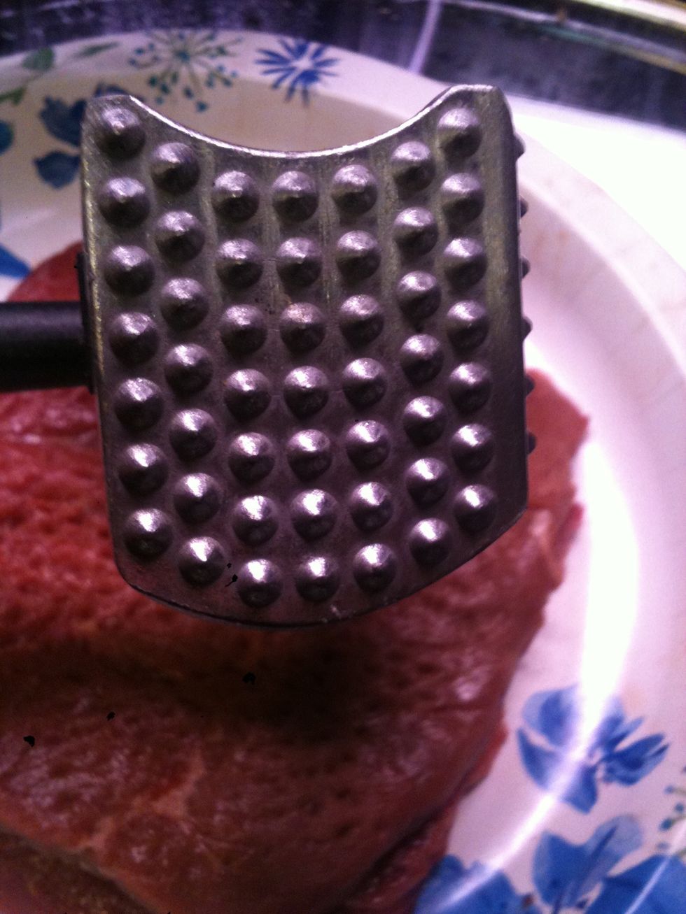 Get a meat tenderizer and pound it gently on the steak with the pokey side not the flat smooth side.