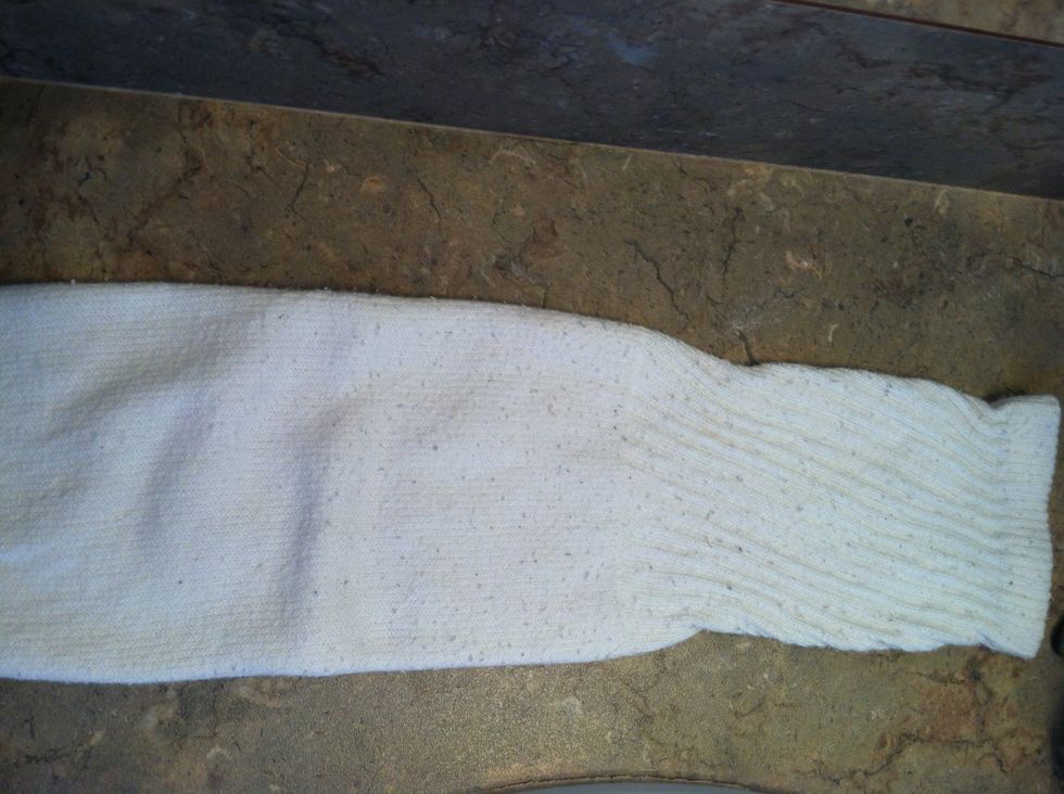 Get a one sock doesn't matter color, the thicker and longer the sock the bigger the bun