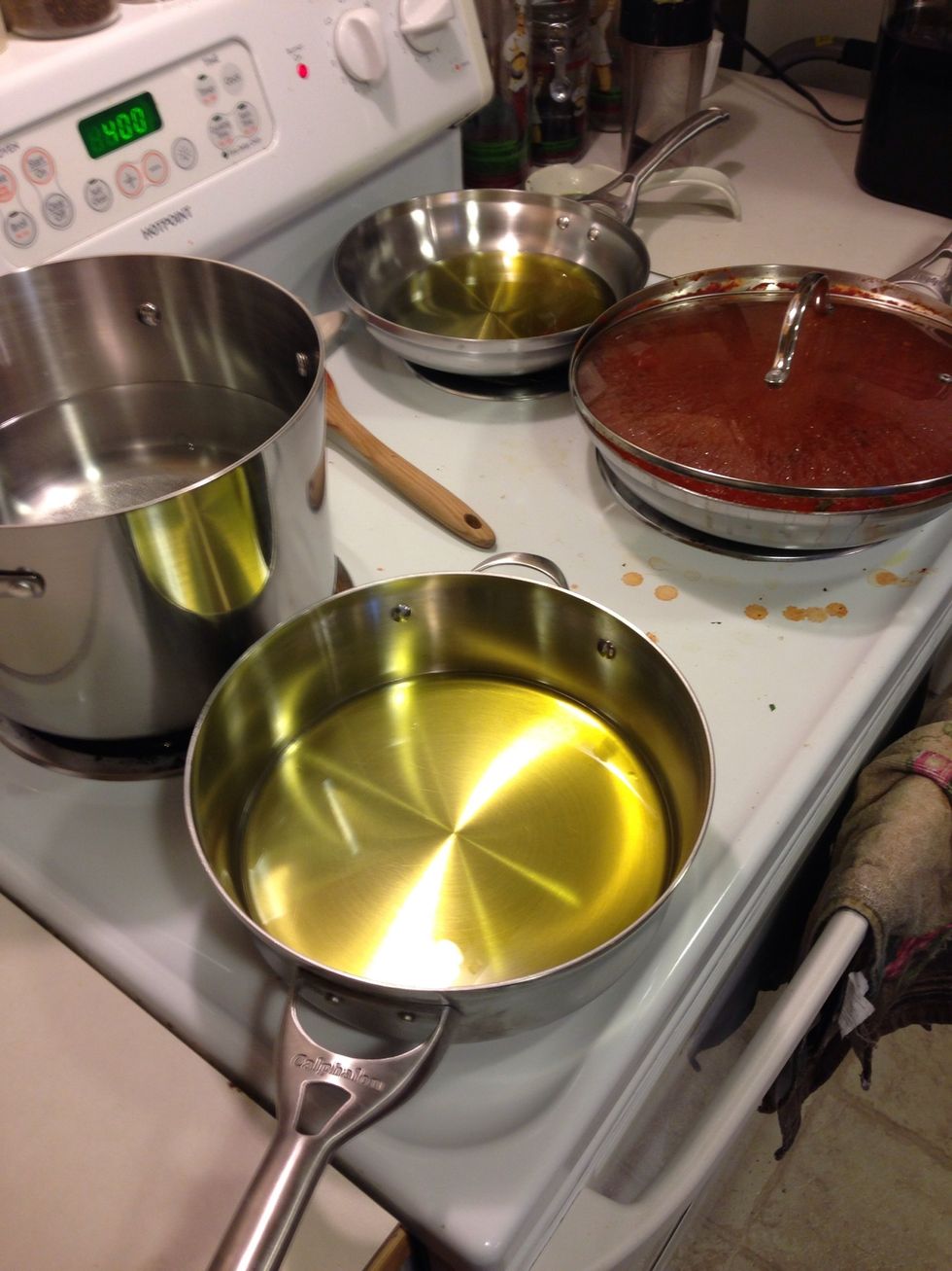 Get a pan or two on medium- high heat with about a half cup olive oil in each, get it nice and hot! I used two pans for 4 servings so I don't crowd and in turn steam the chicken vice fry