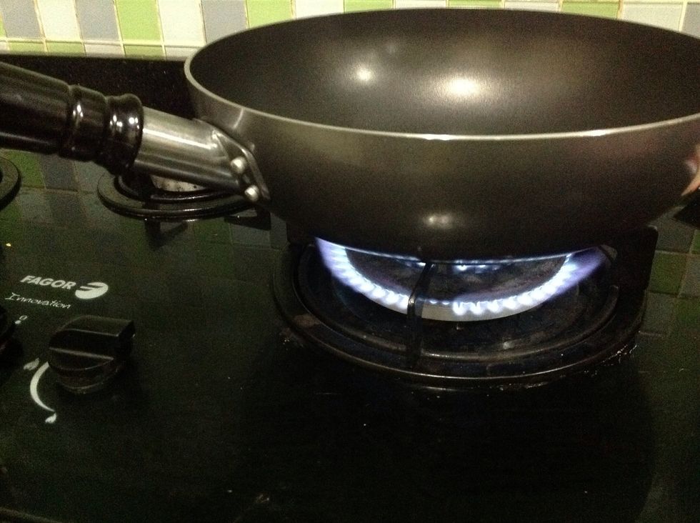 Get a pan with high sides and heat it up on high heat.