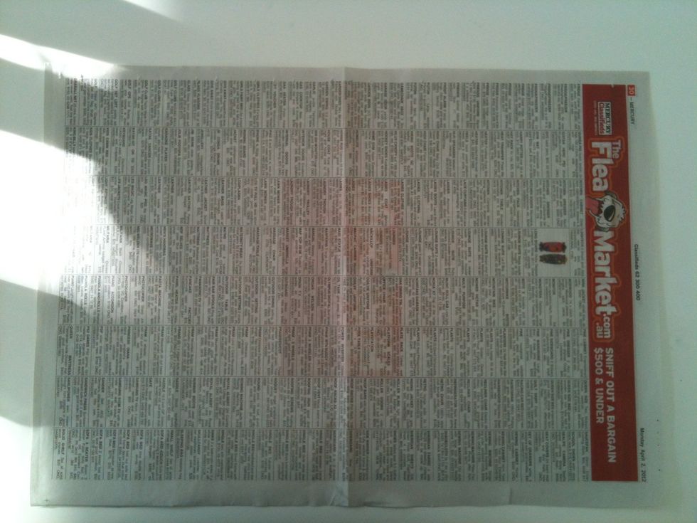 Get a piece of paper this one I'm using is a piece of newspaper.