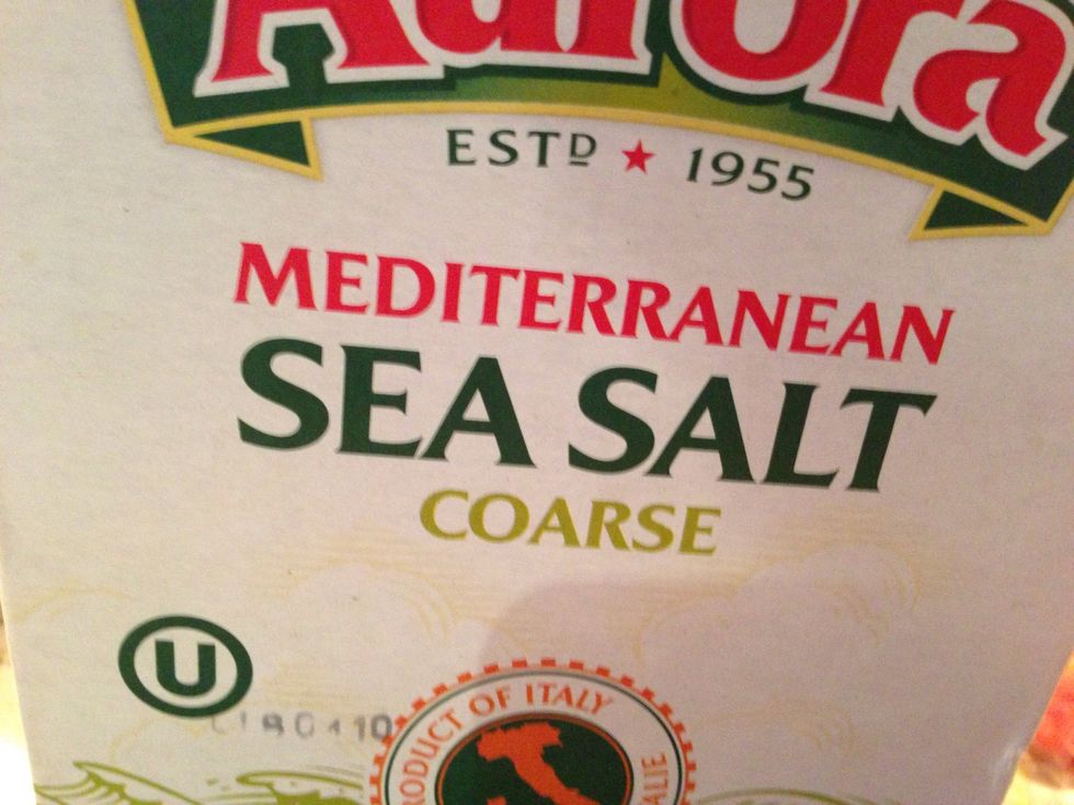 Get a pinch of coarse sea salt and from a high position spread lightly over dough.