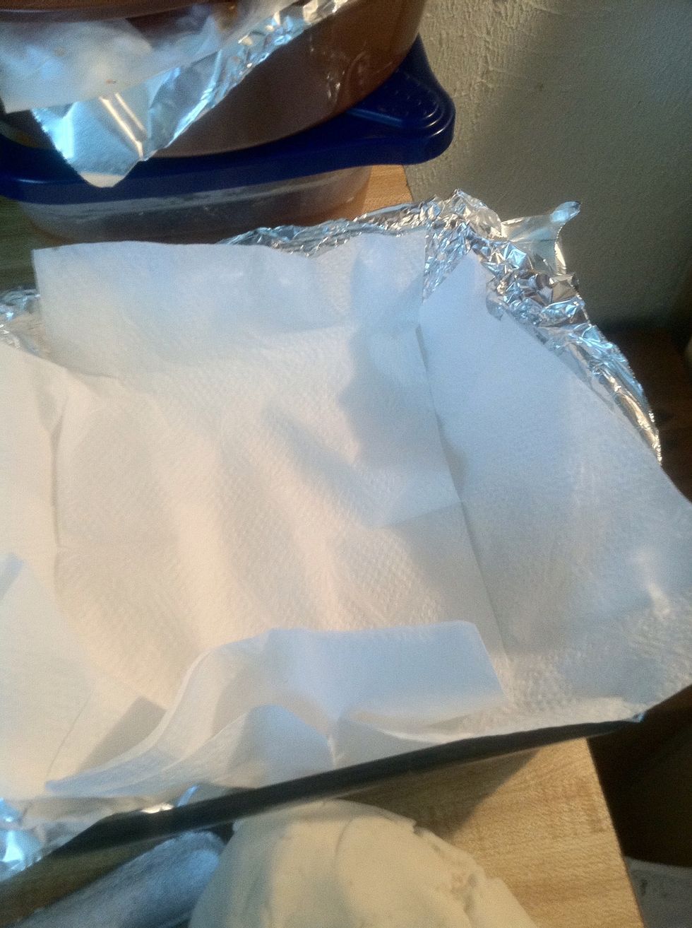 Get a plate / deep dish tray with paper towels to drip excess oil.