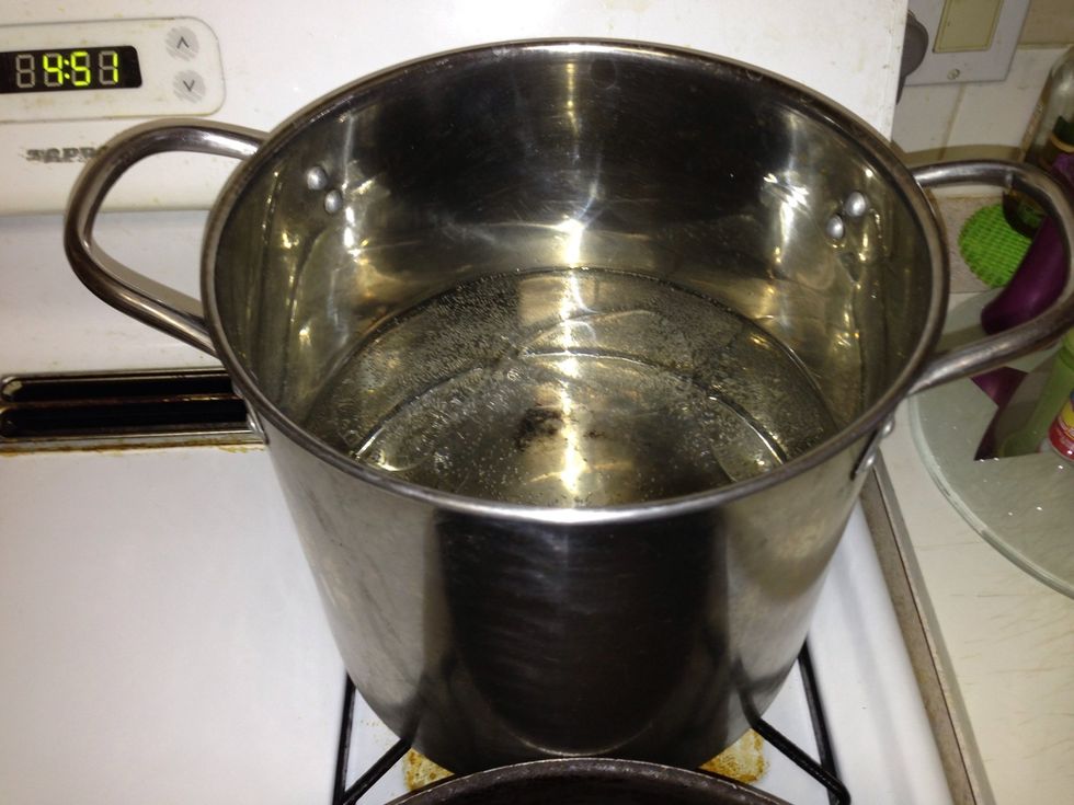 Get a pot and fill with water, oil, and salt. Let this boil while you're doing the rest!