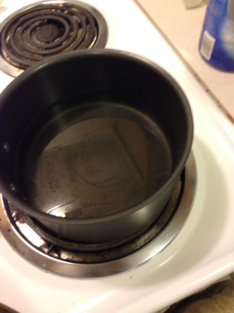 Get a pot with water on and boil. Once boiled turn heat to medium/low and add another bowl on of pot, creating a double boiler