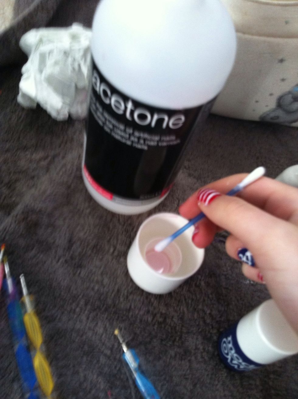 get a q-tip and tip into acetone or nail polish remover and go round all the areas around your nail where you have got polish onto your finger