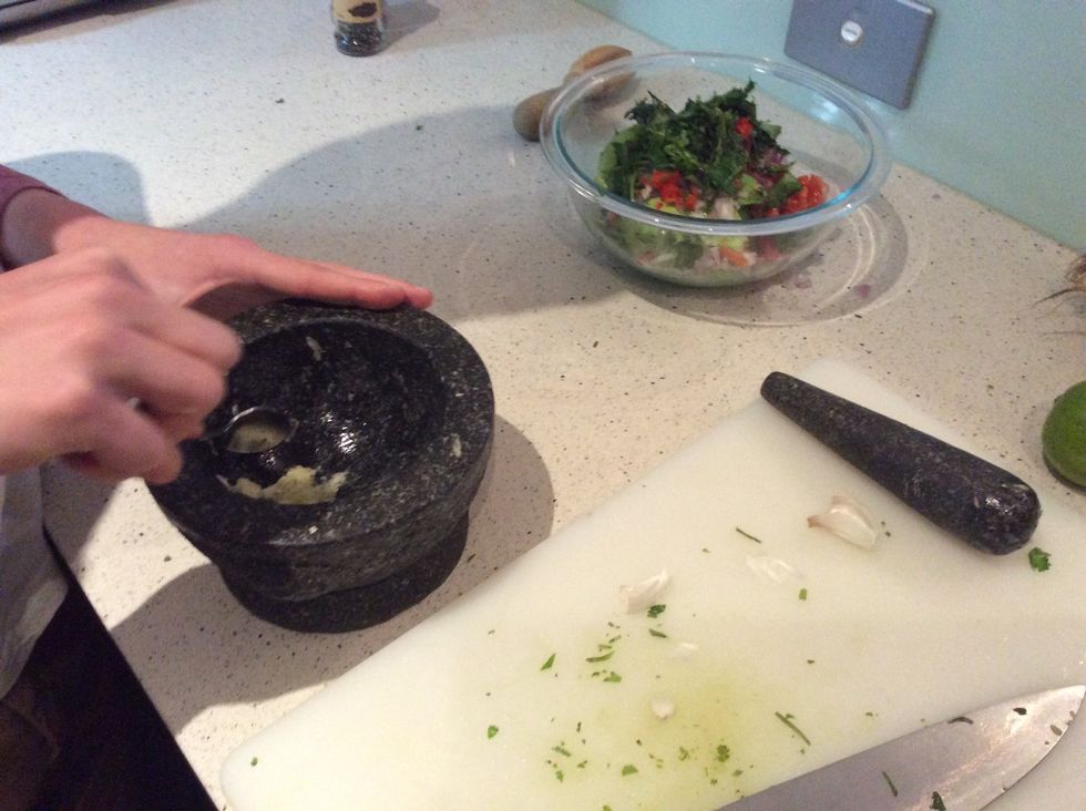 Get a spoon and scoop out all of the garlic and put it into the bowl.