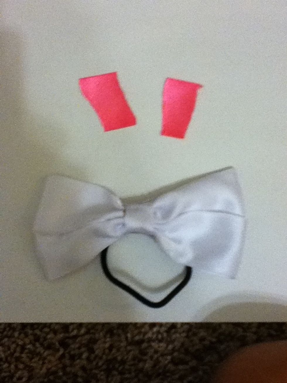 Get a square of ribboin and cut it in half for the middle of the bow