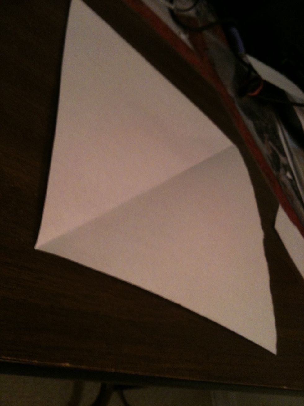 Get a square piece of paper. (This is square, was taken from a weird angle, sorry!)