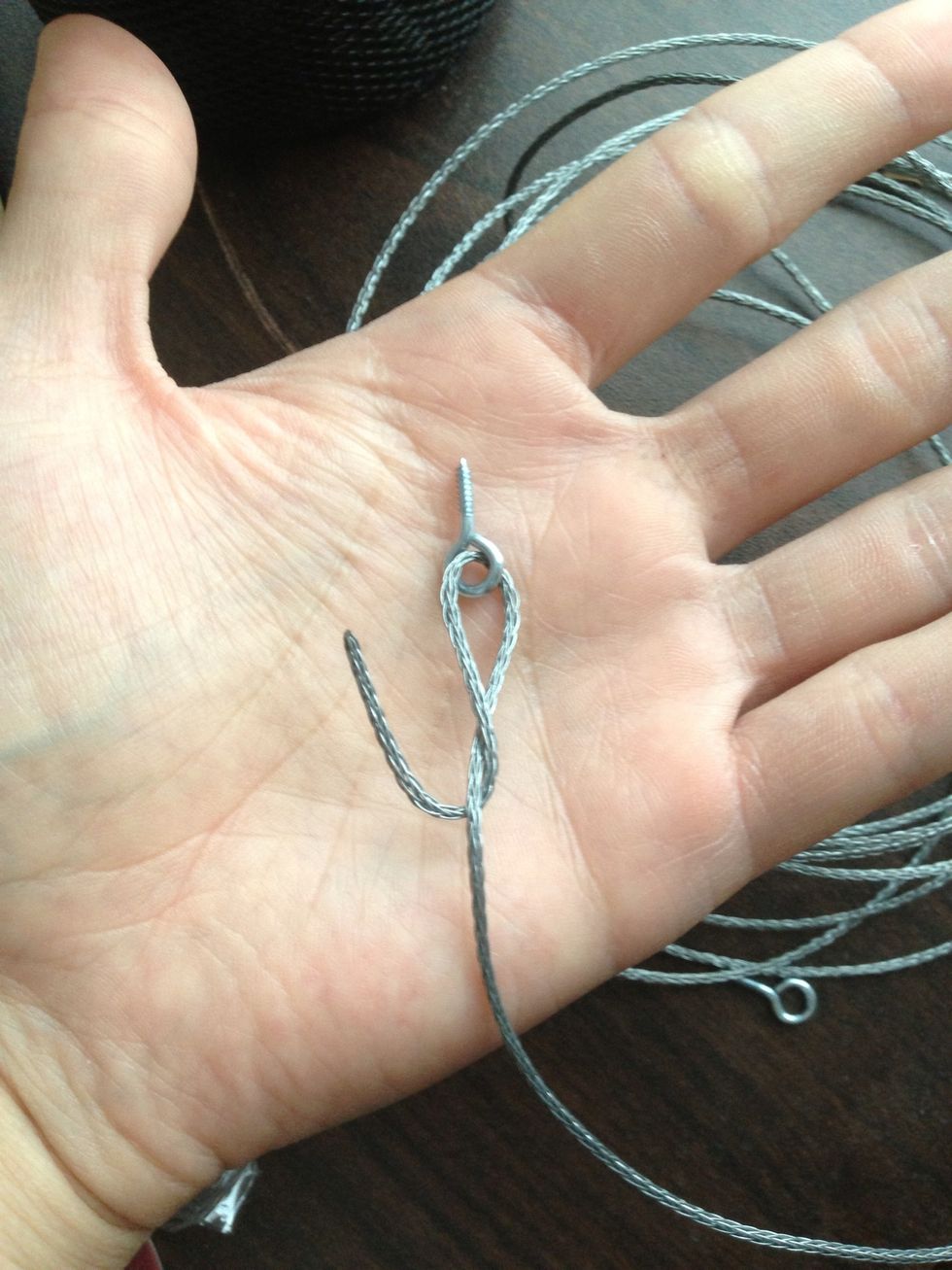 Get about 2 inches through and wrap the end around and around until you can't anymore as shown in the next picture.