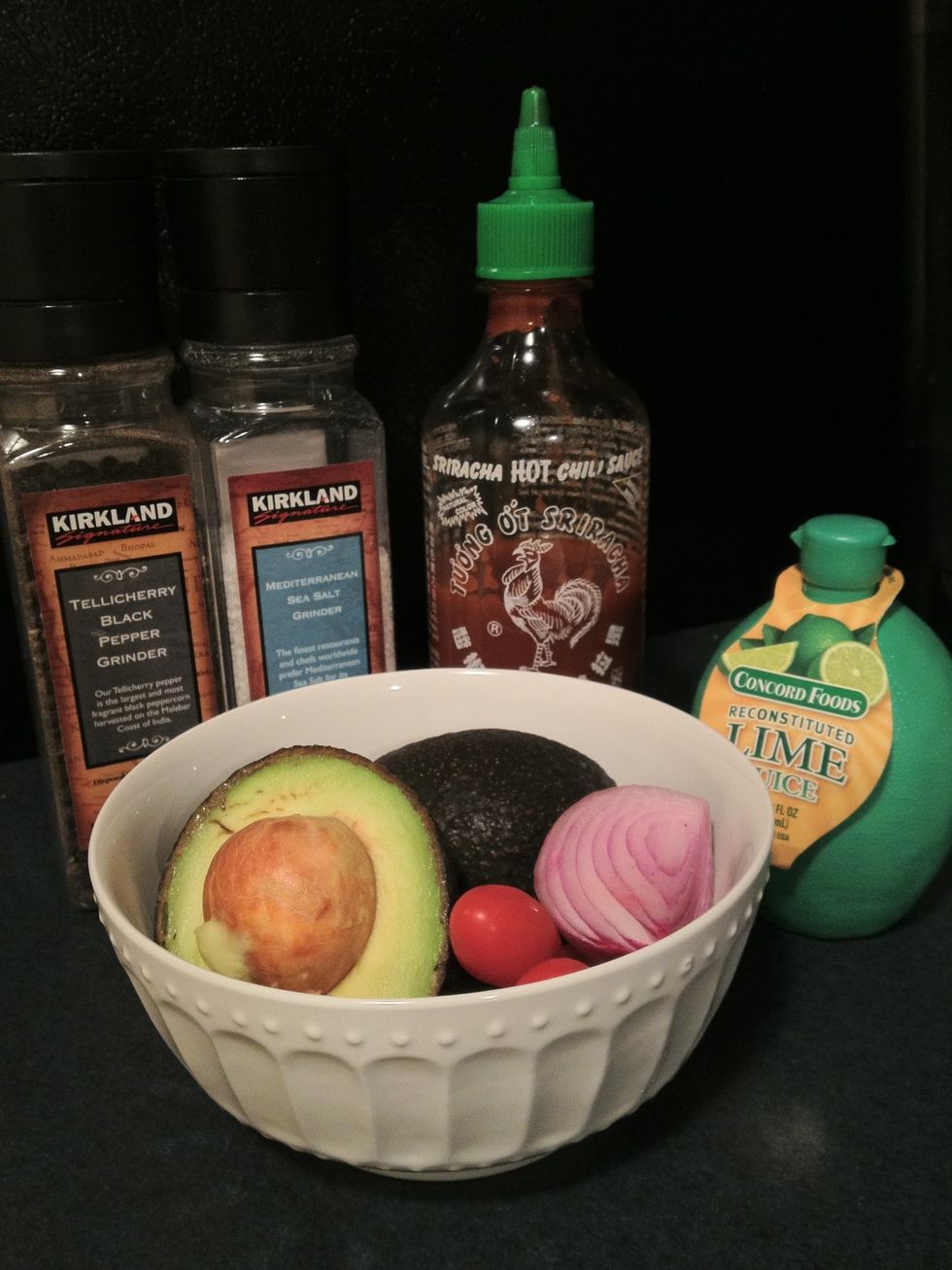 Get all of your ingredients together. Generally I use 1.5 - 2 avocados. Make sure they're ripe and yield to gentle pressure.