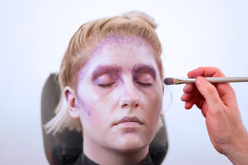Get all the contours you'd like to appear sunken: eye sockets, cheekbones, and temple. Stipple around the hairline.