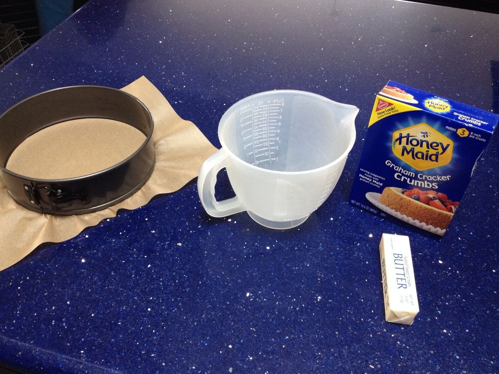 Get all your ingredients needed for the crust together, graham cracker crumbs, butter, and white granulated sugar.