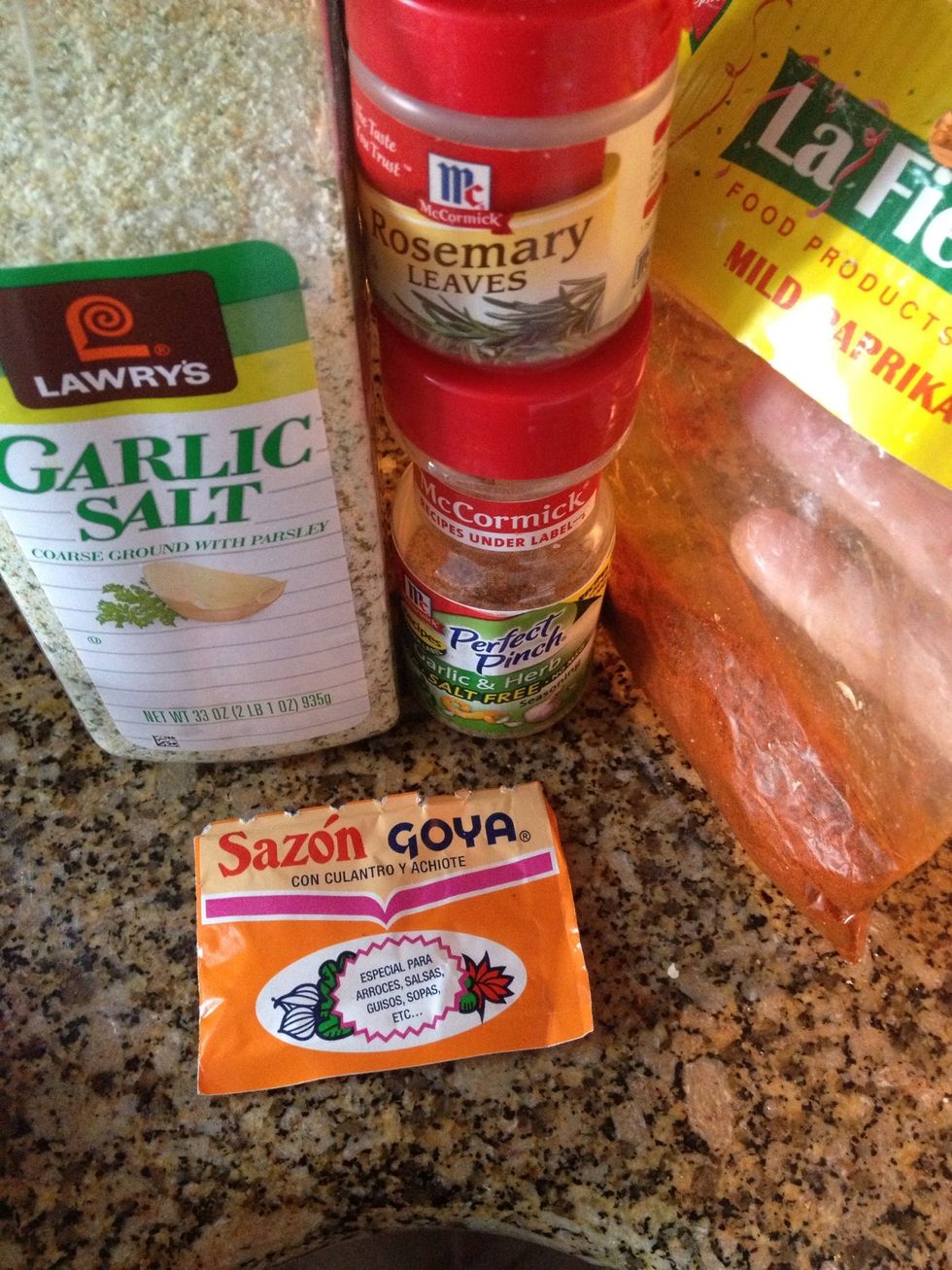 Get all your seasonings ready! Garlic salt, a pinch of rosemary leave (crush them good or use fresh rosemary), paprika, AND the most important is Goya saz\u00f3n seasoning, find in the "Latin" aisle.