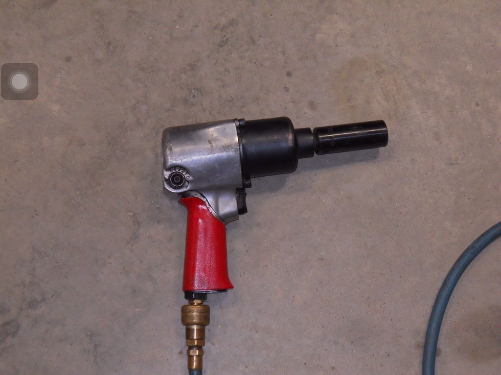 Get an impact wrench or a regular wrench