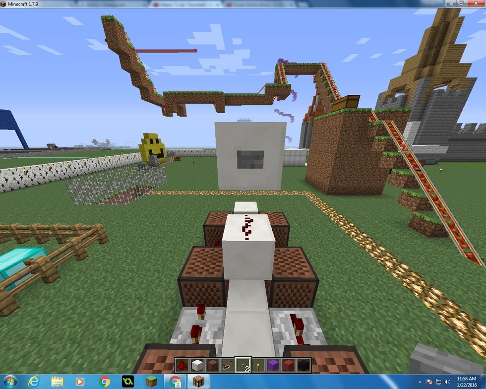 Get another block of Quartz and place it on top of the last block that you put down. Also place a button on it too!