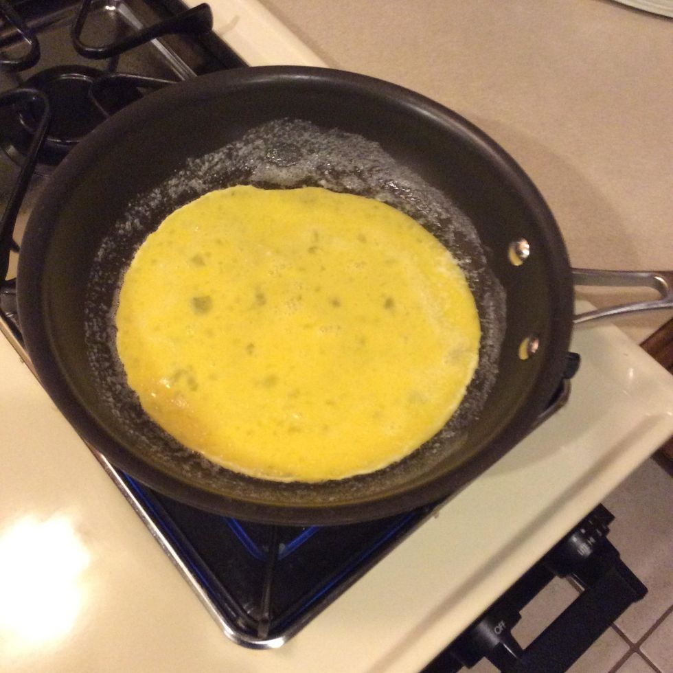 Get another pan and put butter in it and then add your eggs, (with the stove on hi)