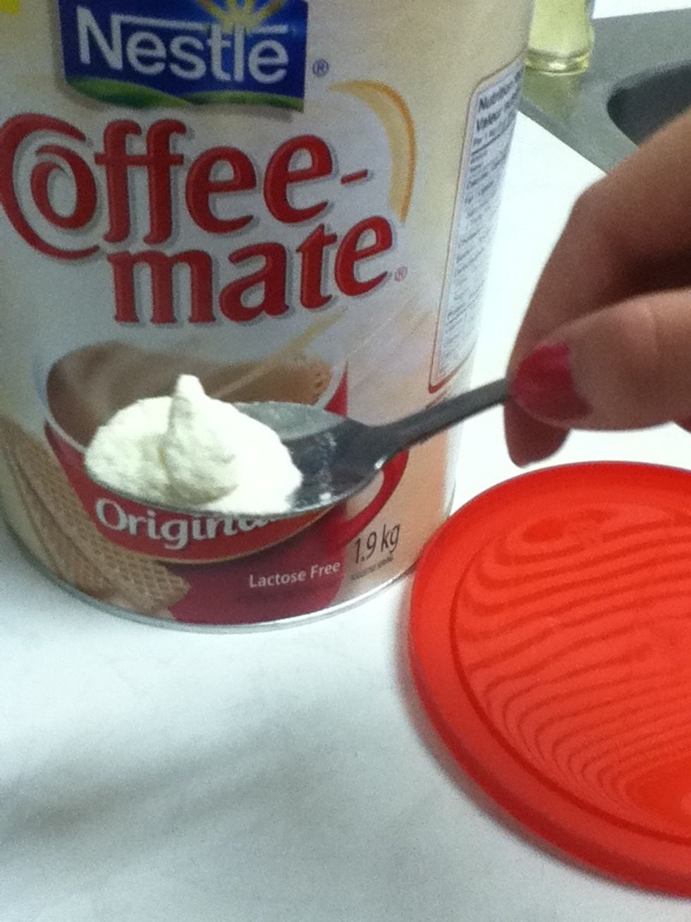 Get any kind of powedered milk and just plop some right into the cup!
