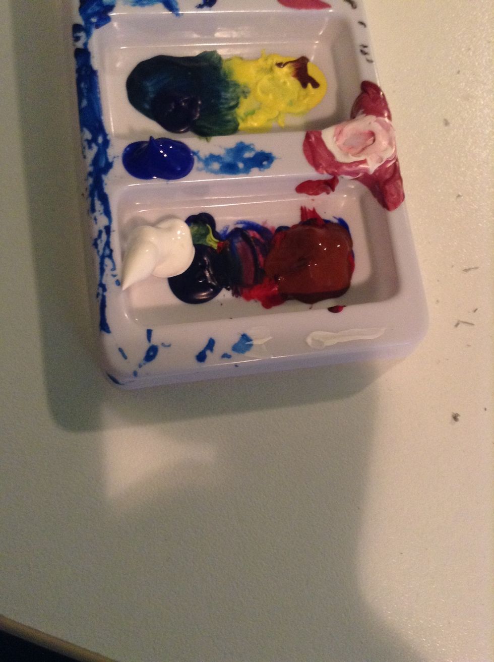 get brown, and some colors u think would be good to mix it with. choose colors u would never guess would go in the trunk. make the perfect brown:)