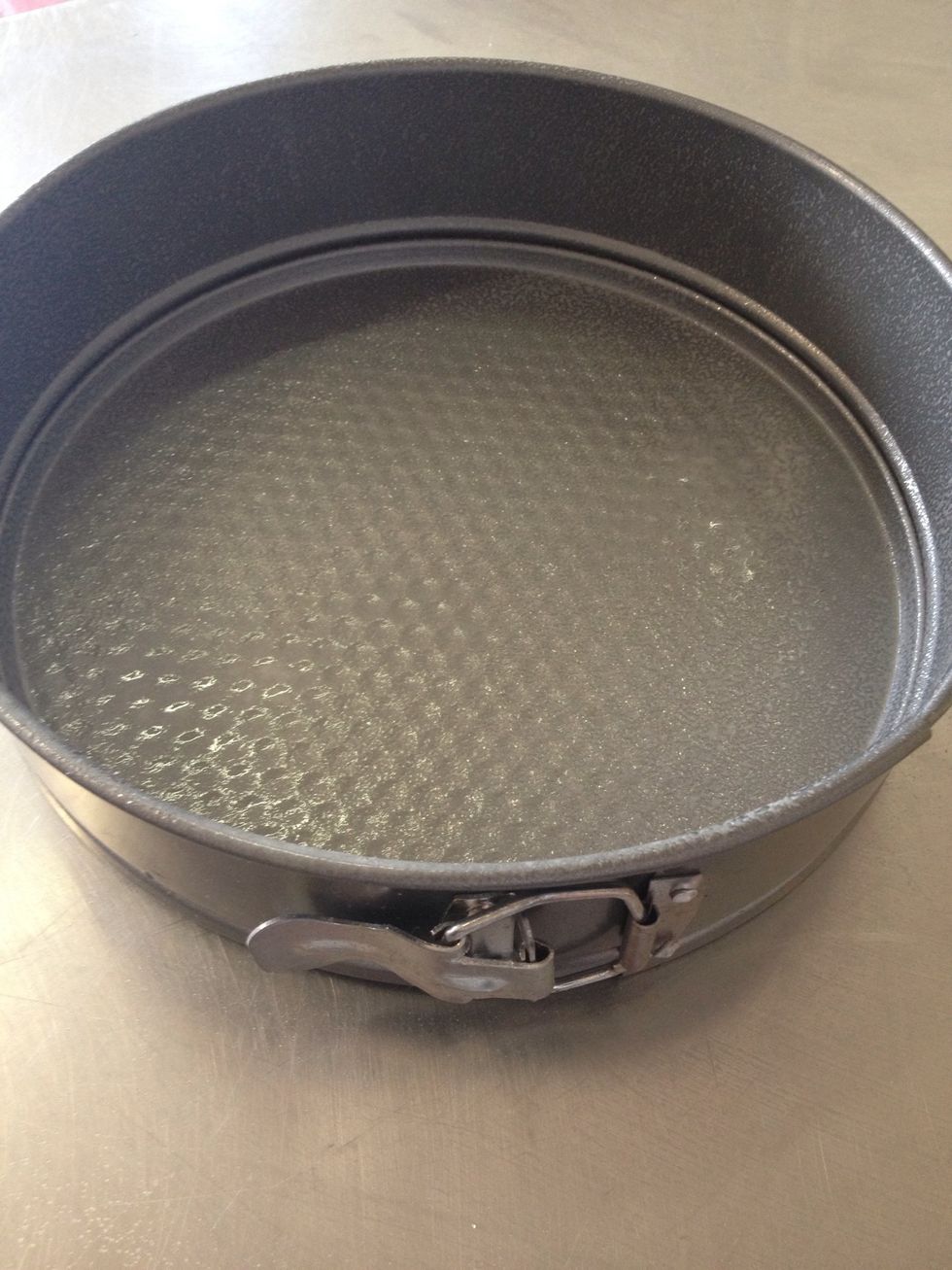 Get cake tin and spray with oil