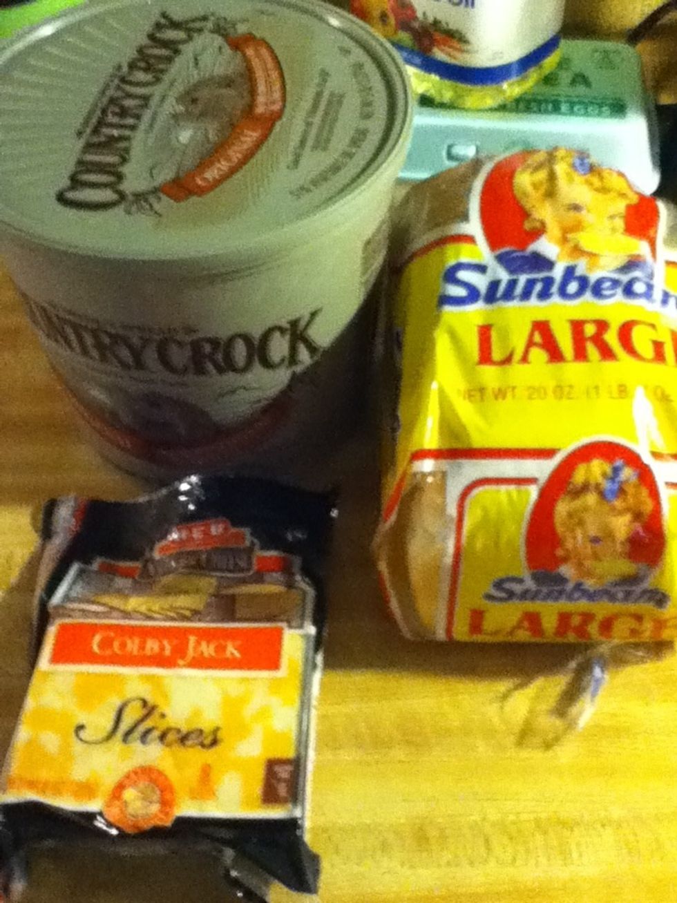 Get cheese , bread ,and butter I .i prefer Colby jack