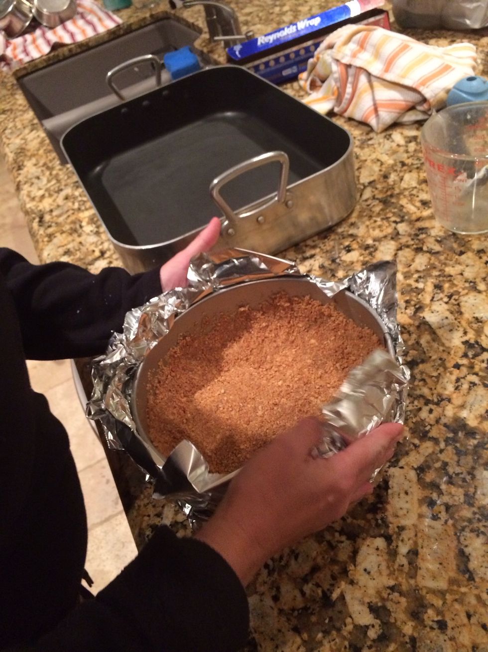 Get crust and place it on a few pieces of tinfoil and fold up the edges and place in roasting pan