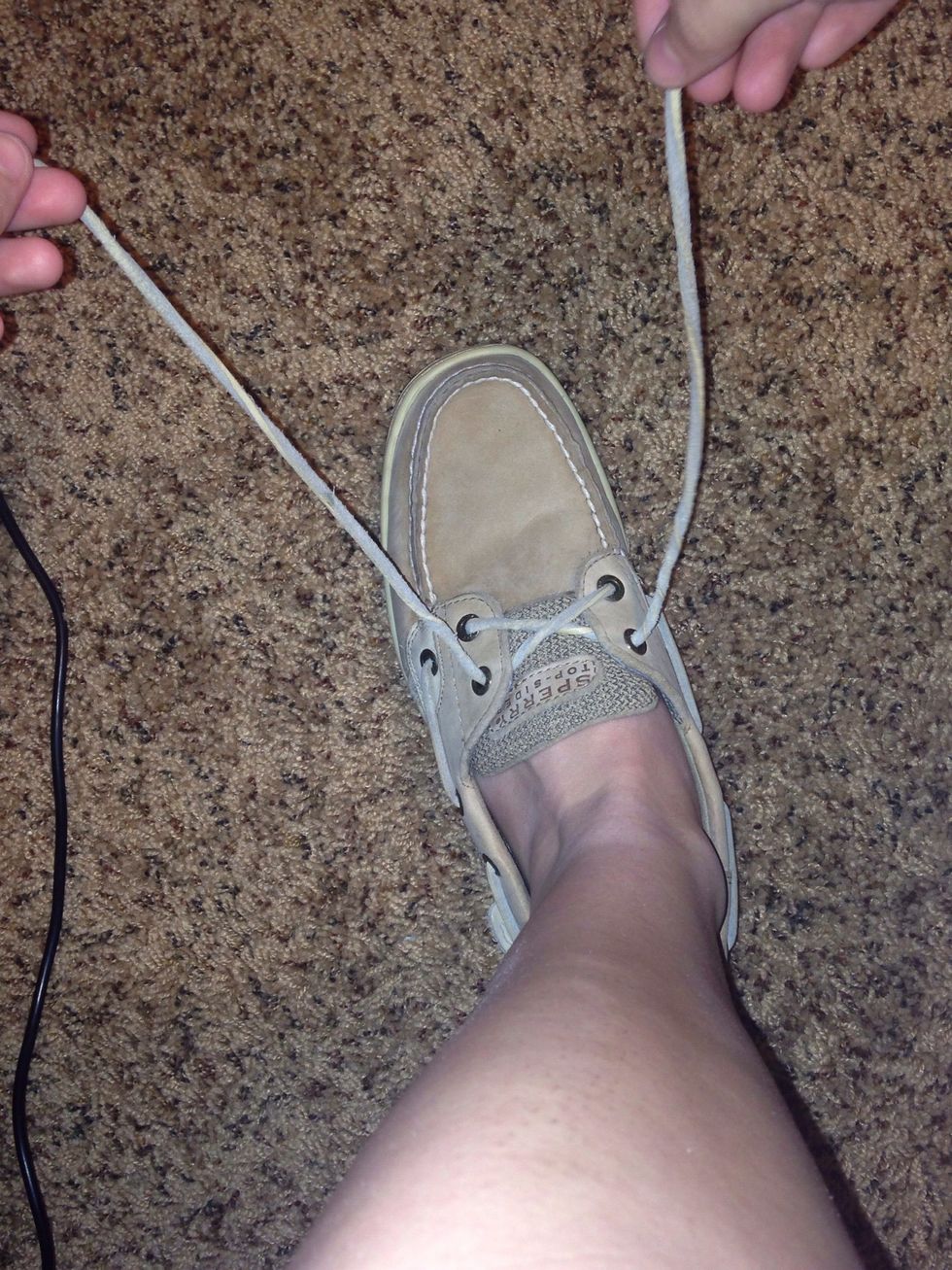 Get each of your laces in each hand.