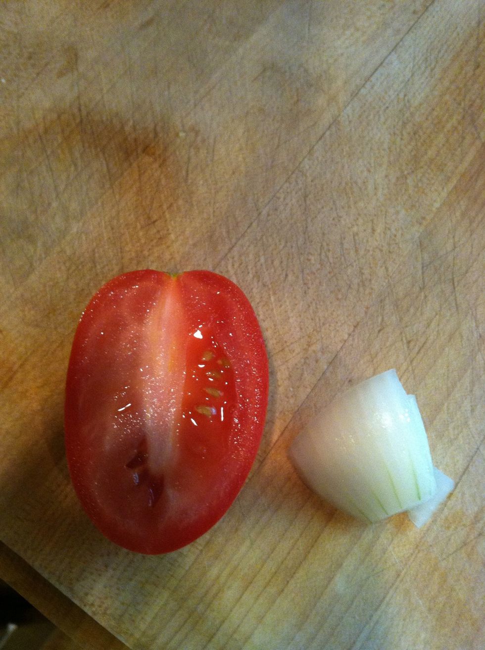 Get half of tomato, and a little piece of onion put in blender with 1/3 cup of water and blend together.