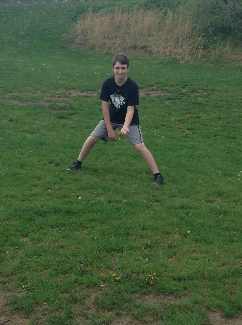 Get in a ready position for the ball