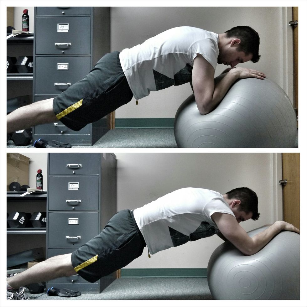 Get into a plank on your knees or on your feet, with your forearms on a gym ball. Roll the ball away from you, keeping a slight arch in the back.  Don't let your back sag in the middle.