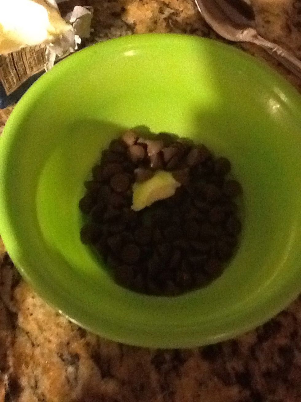 Get microwave safe bowl and add 1/4 cup of chocolate baking chips and 1 tbs of butter