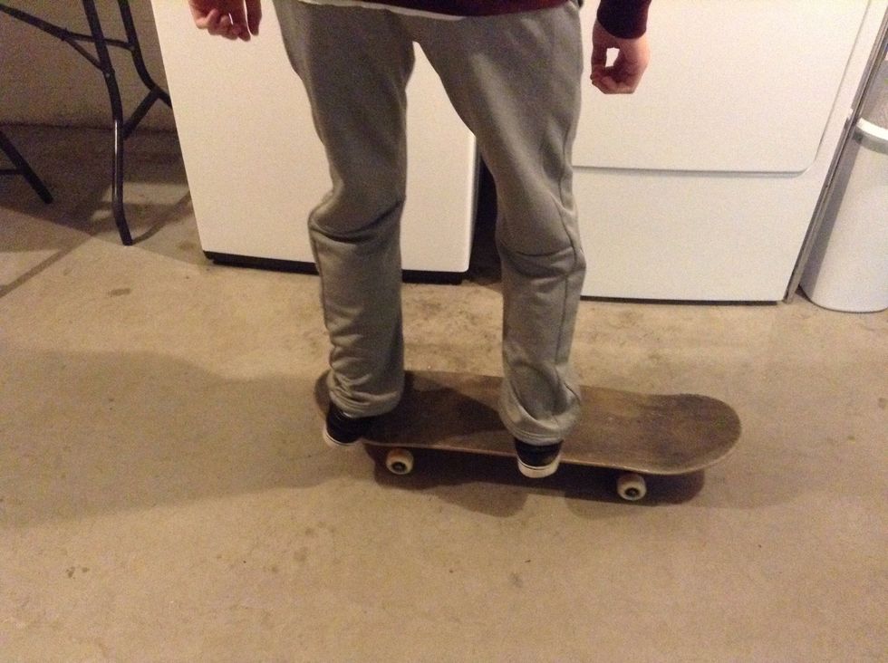 Get on your board with your feet parallel to each other.