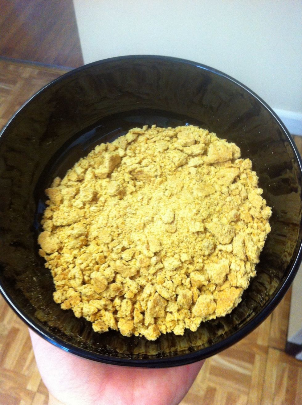 Get one sleeve of graham crackers and crush them up. Put into a bowl or plate.