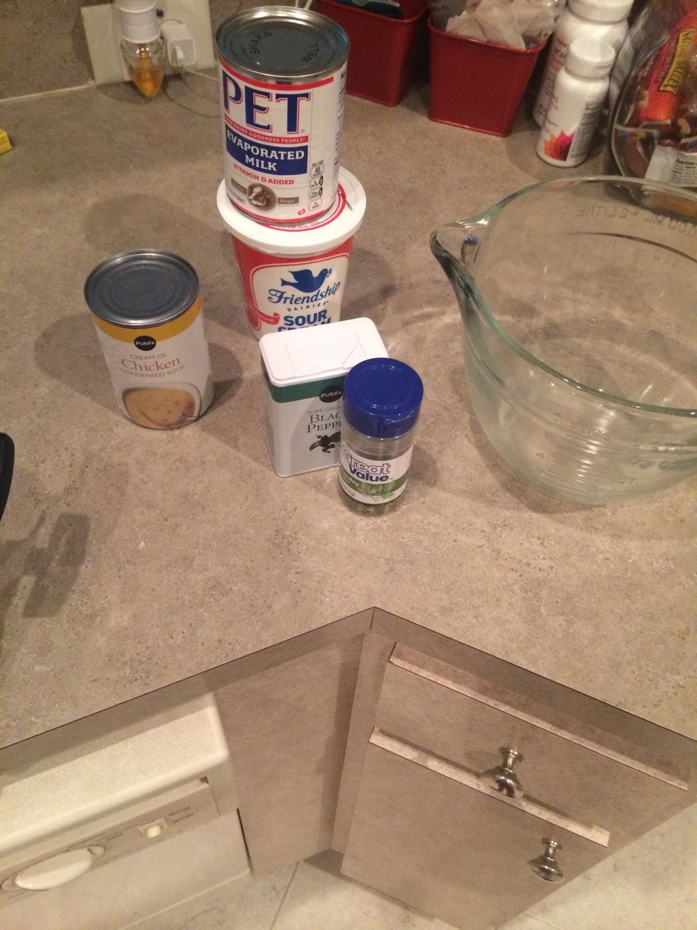 Get out a large bowl and combine soup, sour cream, milk, parsley and pepper.