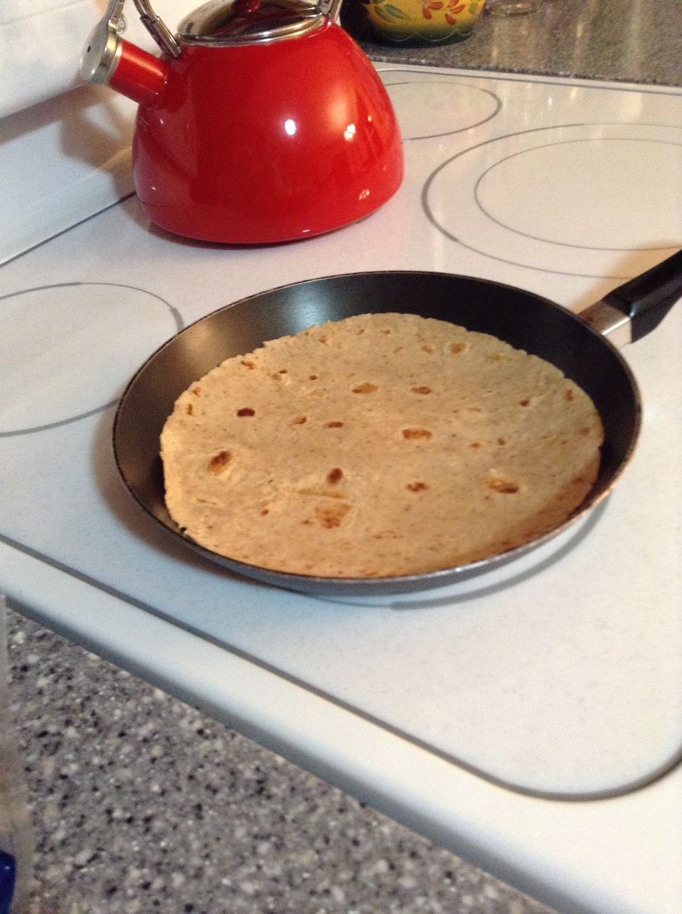 Get out a pan/skillet large enough to hold the tortilla