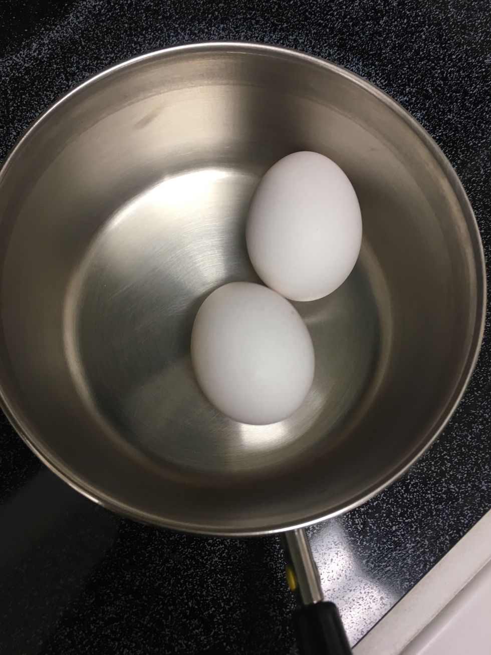 Get out saucepan and put in eggs.