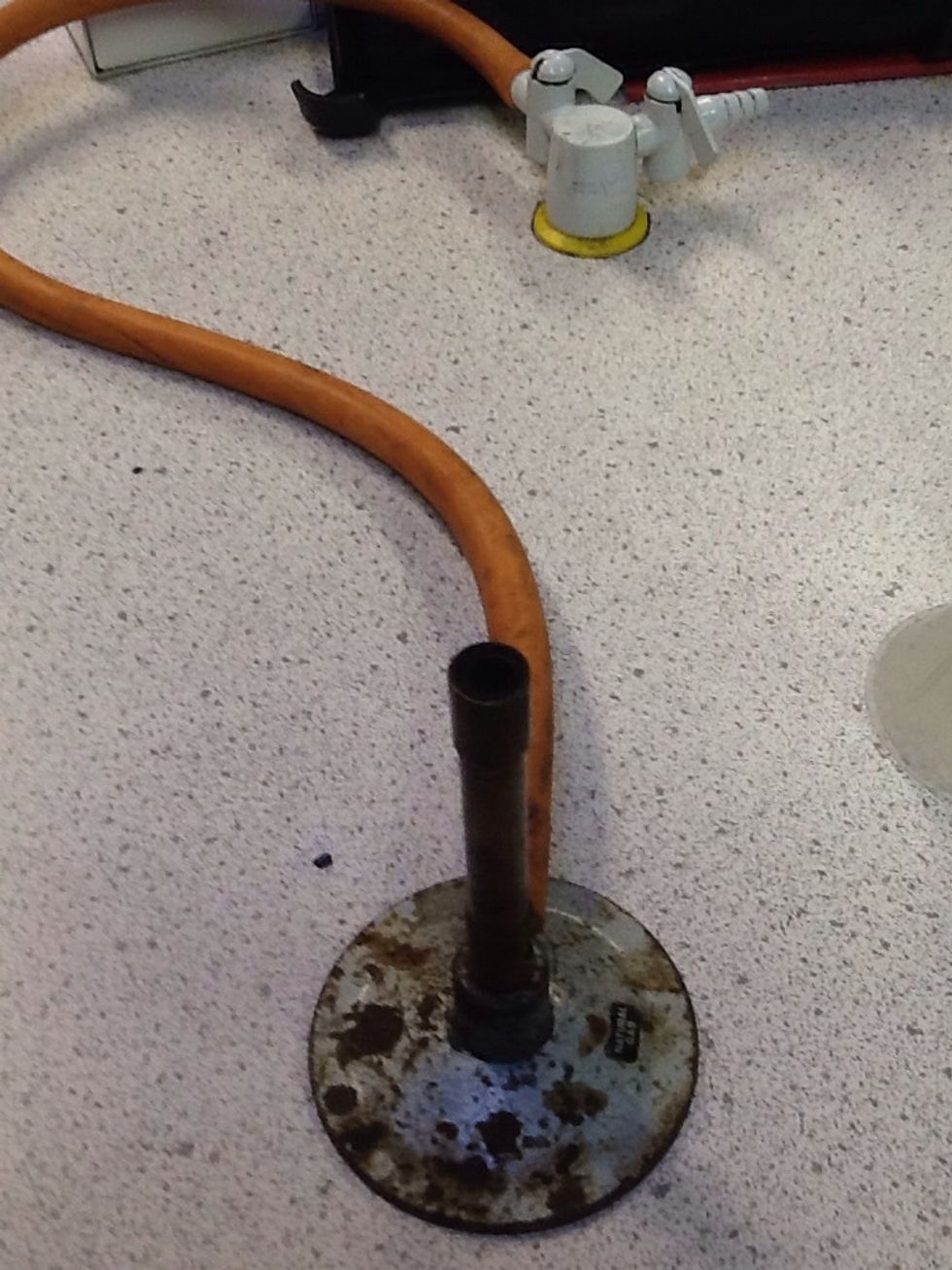 get out your Bunsen burner.when you get your burner out make sure the tube that carries the gass is tightly screwed on so no gas can escape.