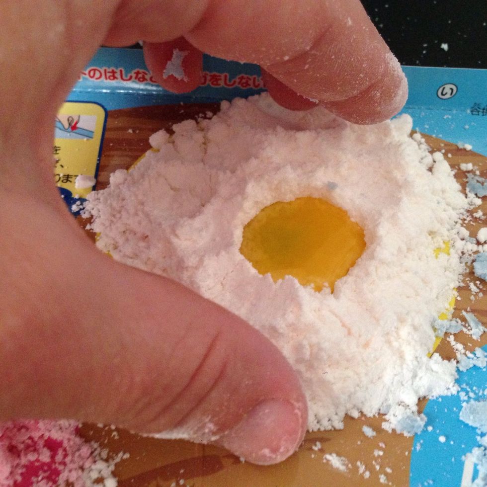 Get Ready to Pinch and fold and mixuntil you see all yellow and moist powder
