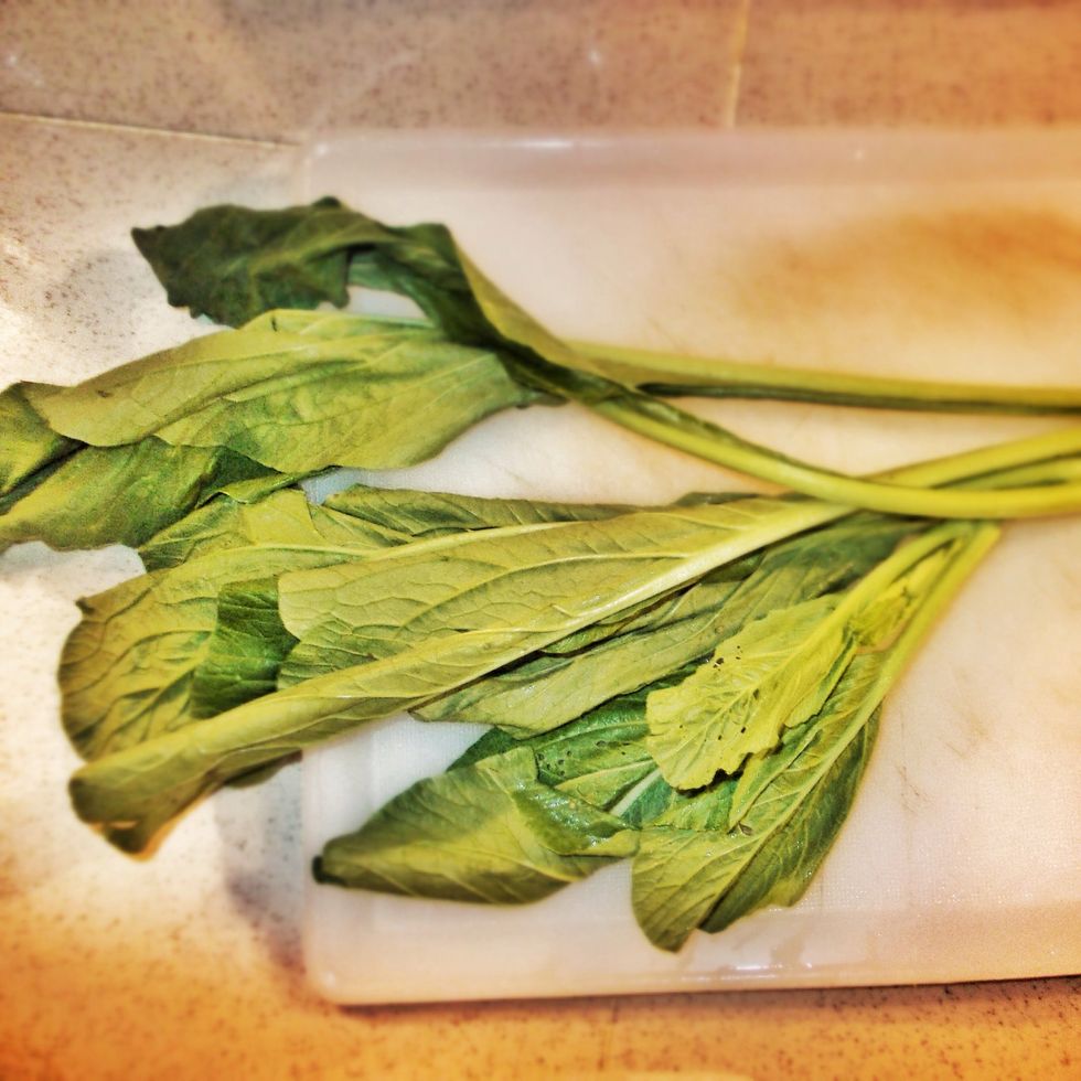 Get ready to prepare the mustard greens. It's called Sayur Sawi in Malaysia, or Sayur Chai Sim Indonesia. You could substitute this with Bock Choy.