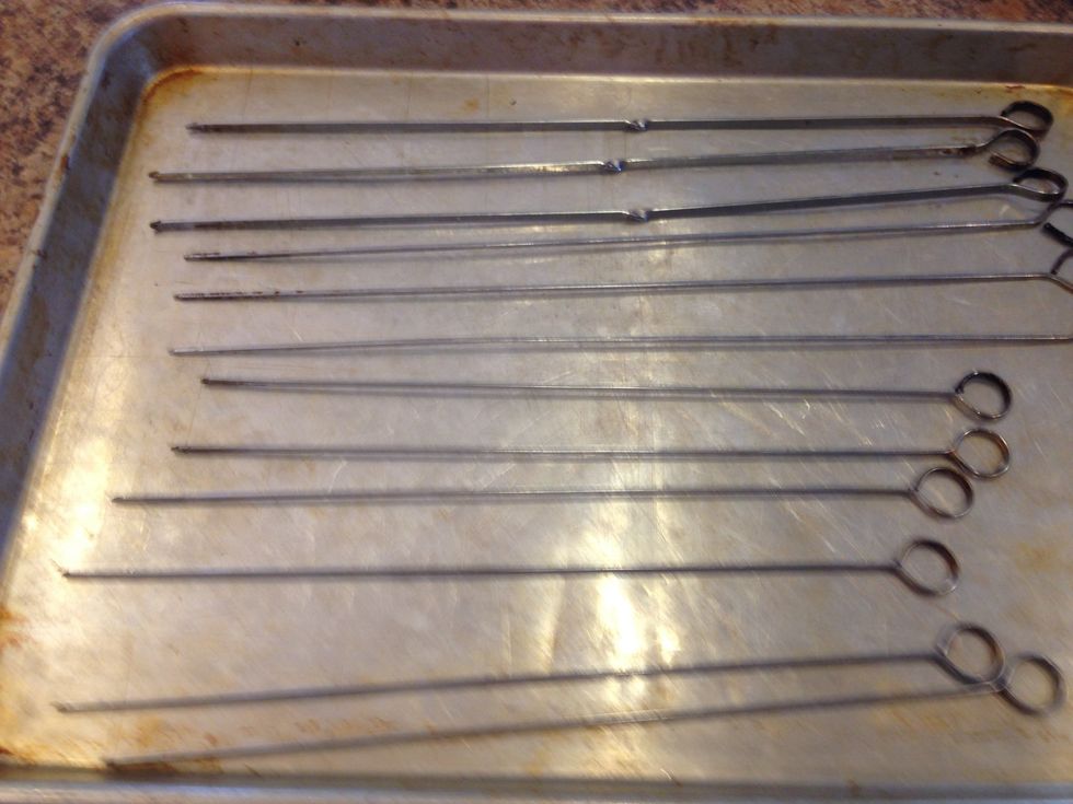 Get ready to skewer. I use metal skewers because they are easier to thread, they won't lite on fire, and most of the time they are larger so you can fit more on each one.