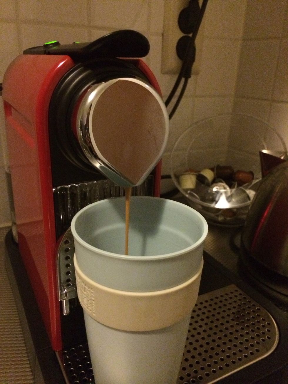 Get rid of the water and put your cup back in place. Press the espresso button.