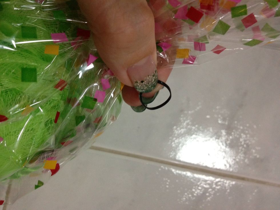 Get small black hair rubber band to tie it