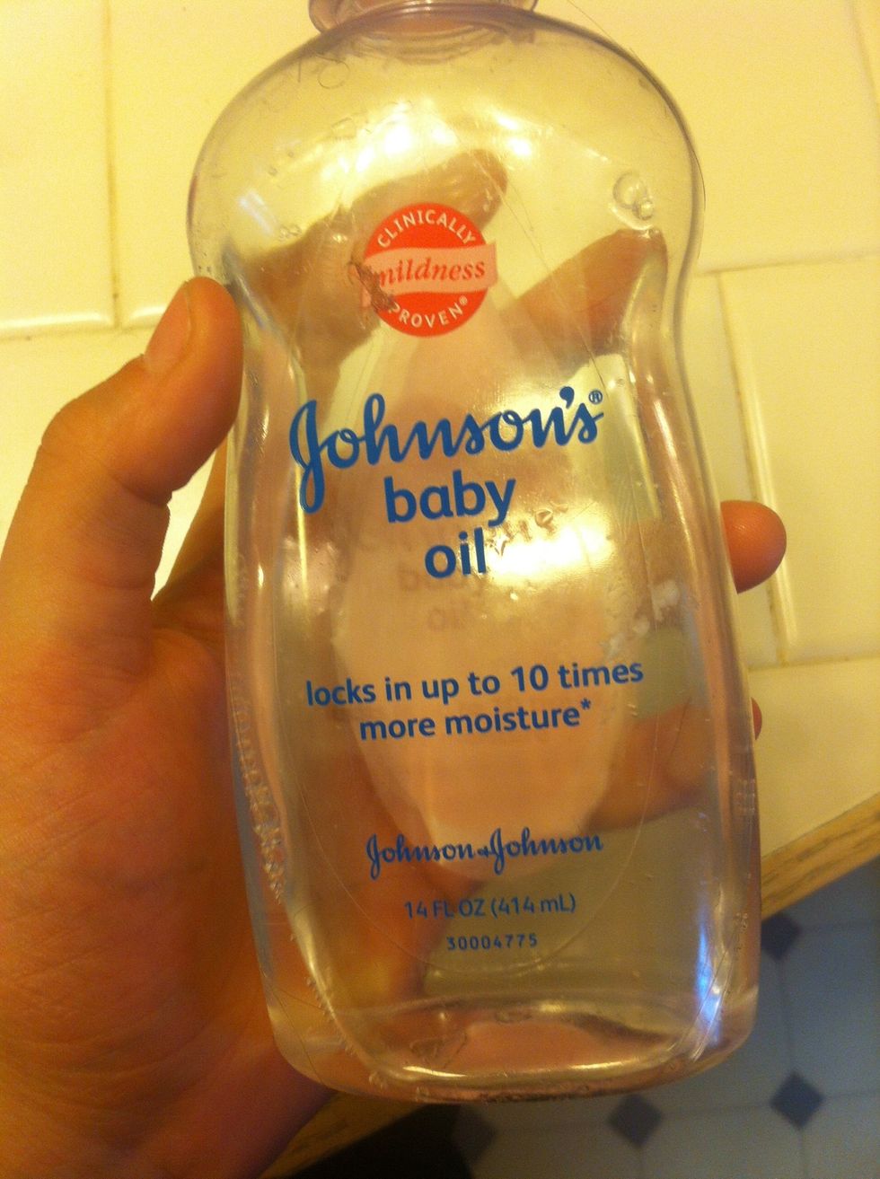 Get some baby oil, baby shampoo will work also