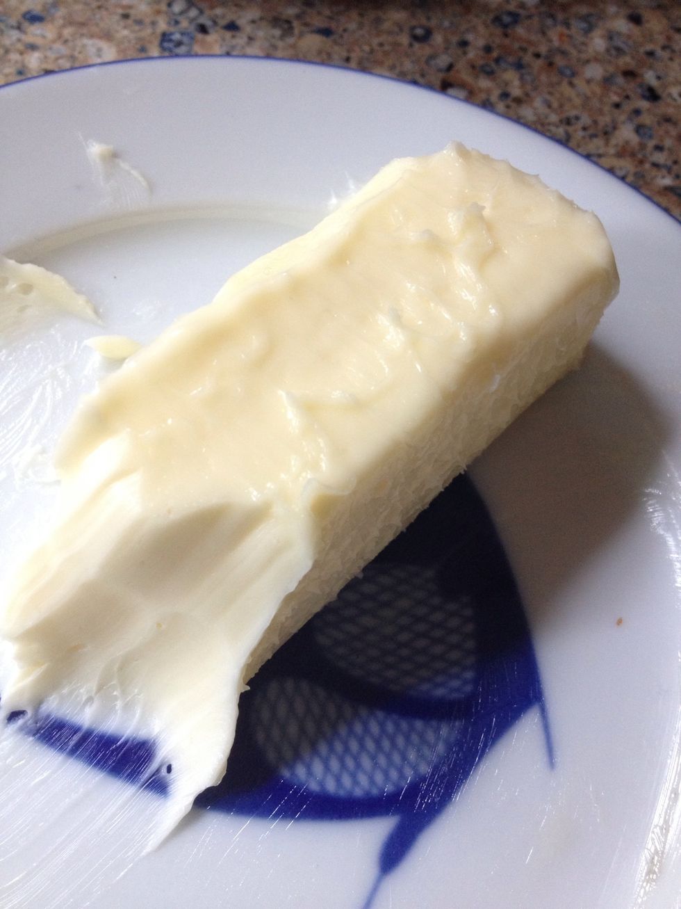 Get some butter softened by microwaving it in 7 sec bursts, flipping the stick over a couple times and checking it.