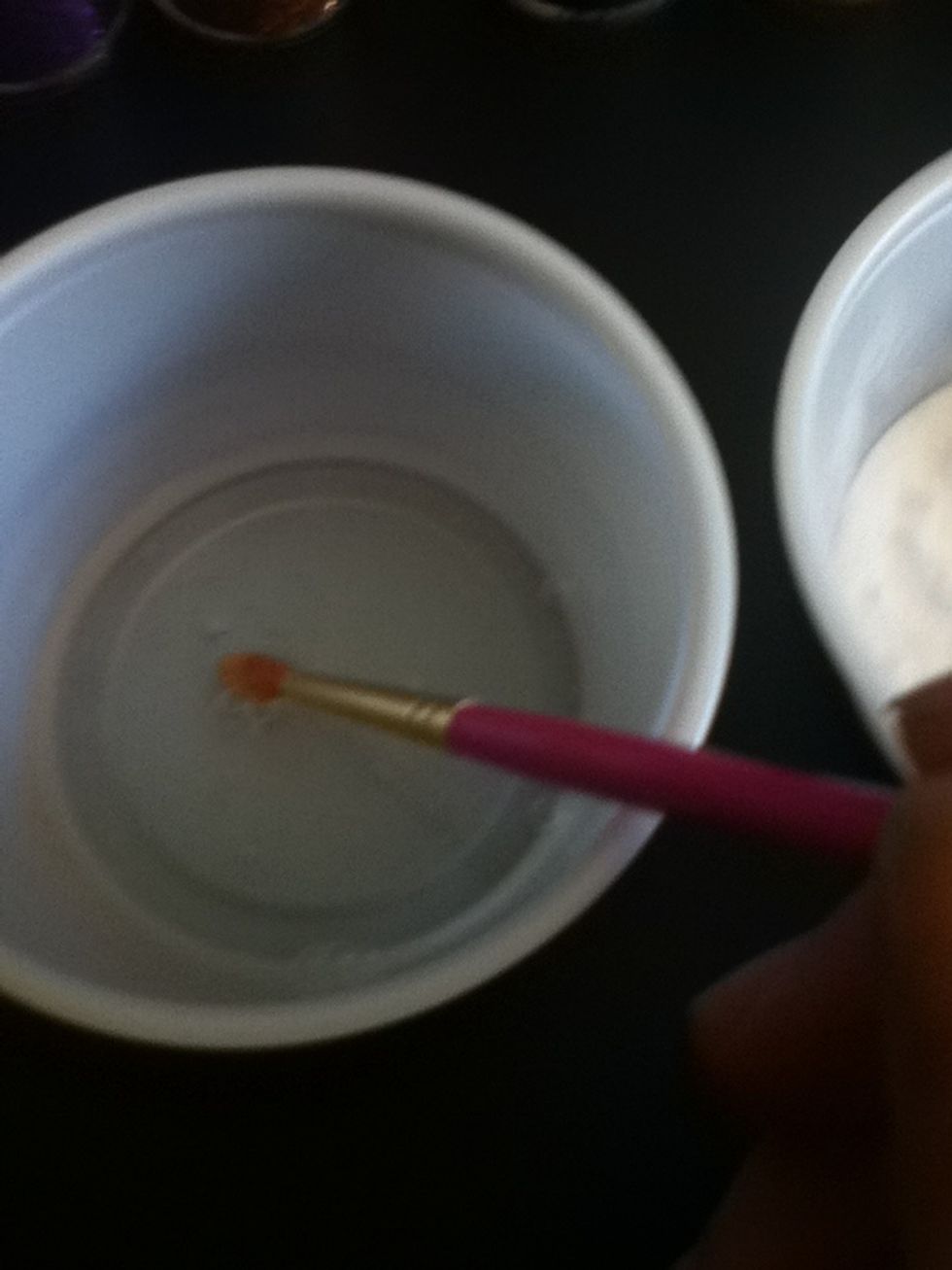 Get some clear glue on your paintbrush